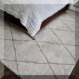 D12. Wool tan and brown diamond pattern rug. 9'10” x 8'5” - $295